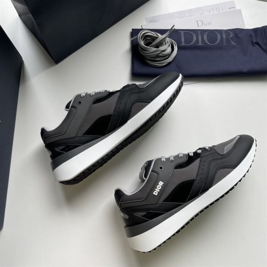 Pair of grey and black Dior B29 low top trainers laid flat
