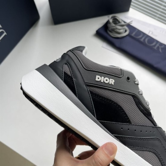 Close-up view of Christian Dior side branding and white rubber sole in grey and black