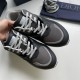 Top-down view of grey and black Dior B29 trainer toe boxes and laces
