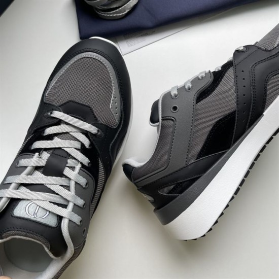 Close-up view of grey mesh and black leather upper on Dior B29 trainer