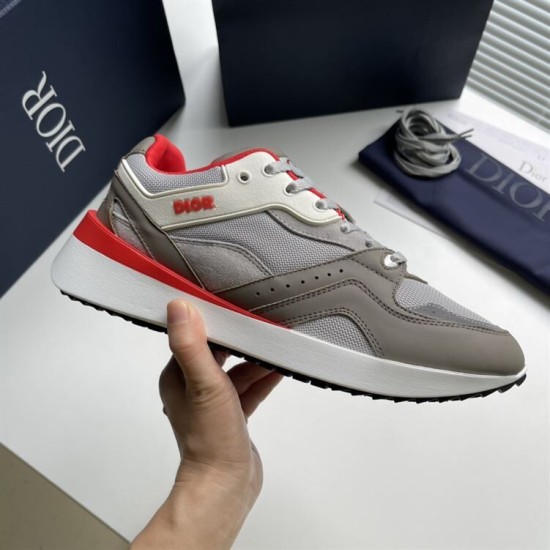Dior B29 Grey And Red Low Top Trainer Side Detail Dior B29 Grey And Red Low Top Trainer held side profile view