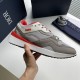 Dior B29 Grey And Red Low Top Trainer Side Detail Dior B29 Grey And Red Low Top Trainer held side profile view