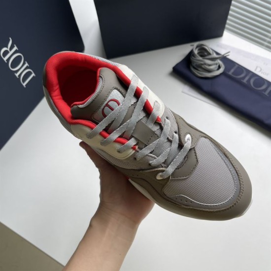Dior B29 Grey And Red Low Top Trainer Top Close-Up Dior B29 Grey And Red Low Top Trainer held close-up top view