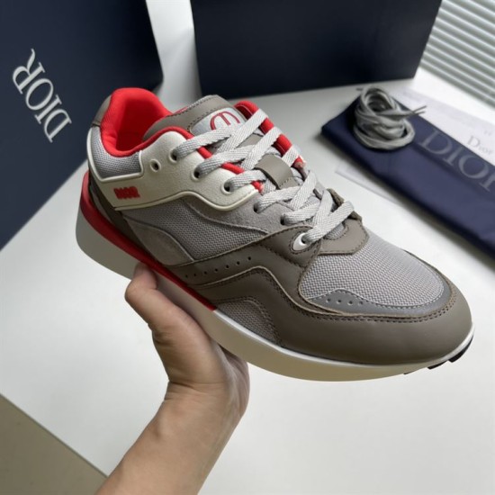 Dior B29 Grey And Red Low Top Trainer Front Angle Dior B29 Grey And Red Low Top Trainer held three-quarter front angle view