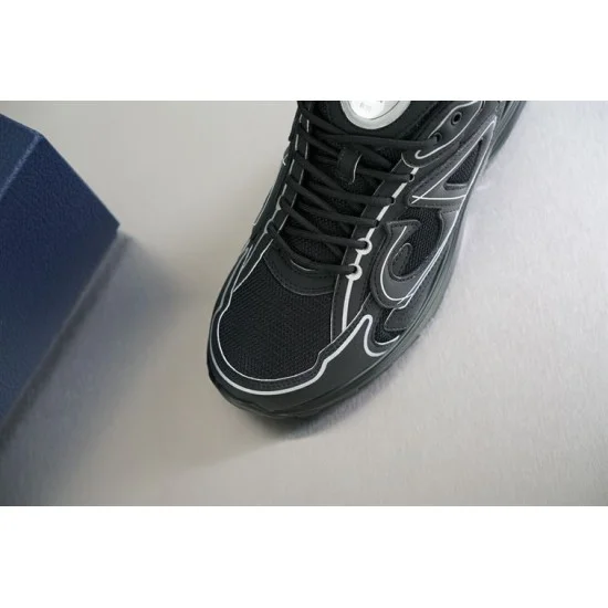 Detailed close-up of toe box mesh and reflective piping on black Dior B30 trainer