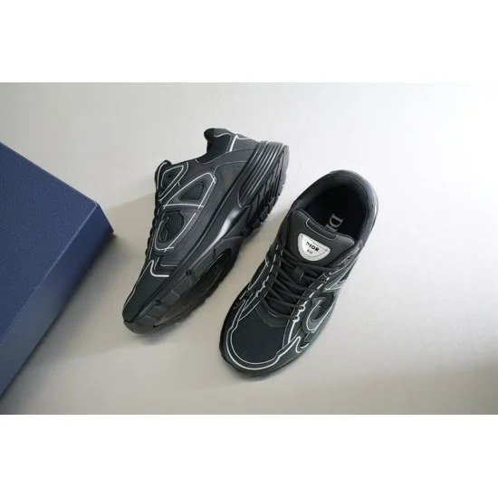 Angled top pair arrangement of Dior B30 black low top trainers