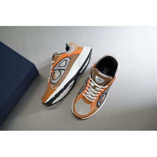 Dior B30 Trainers Pair Angle in beige and orange Angled pair arrangement of Dior B30 trainers showcasing uppers and soles in beige and orange
