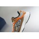 Dior B30 Side Panel Detail in beige and orange Close-up view of the side CD motif and heel midsole on Dior B30 trainer in beige and orange