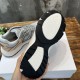Underside of Dior B30 trainer showing black rubber sole and CD branding in grey and pink
