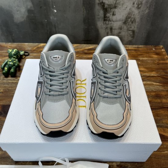 Front view of Dior B30 grey and light pink mesh trainers with lacing detail