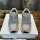 Front view of Dior B30 grey and light pink mesh trainers with lacing detail
