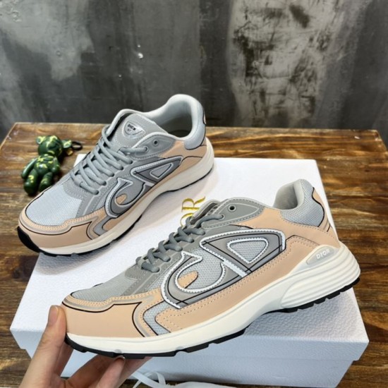 Top-down view of a pair of Dior B30 grey and light pink technical trainers