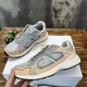 Top-down view of a pair of Dior B30 grey and light pink technical trainers