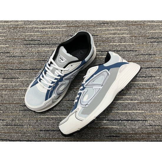 Dior B30 Light Blue Trainers Diagonal Pair Dior B30 light blue mesh trainer pair arranged diagonally