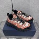Dior B31 Runner Trainers Pair View in beige and orange Pair of Dior B31 Runner trainers in beige and orange resting on a shoe box