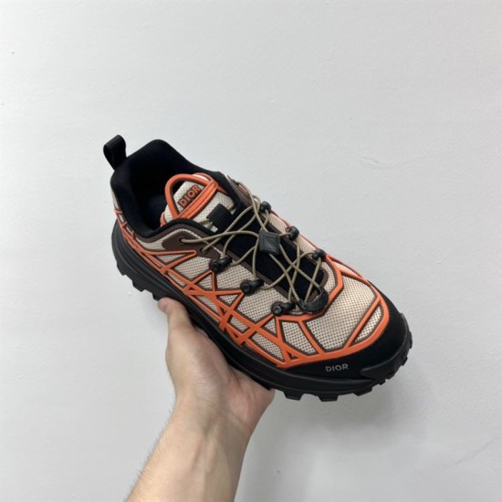 Dior B31 Runner Handheld Top View in beige and orange Hand holding a Dior B31 Runner beige and orange trainer from an overhead perspective