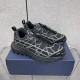 Dior B31 Runner Black Mesh Trainers Pair View Pair of Dior B31 Runner Black Mesh Trainers resting on a blue display box.