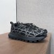 Dior B31 Runner Black Mesh Trainers Angled View Angled view of Dior B31 Runner Black Mesh Trainers displaying lugged soles and speed lacing.