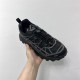 Dior B31 Runner Black Mesh Trainer Three-Quarter View Three-quarter top view of Dior B31 Runner Black Mesh Trainer held against a white background.