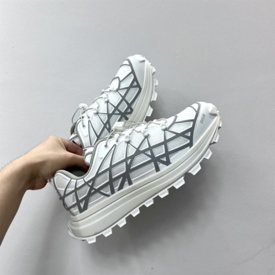 Dior B31 Runner Low Top Trainers In White Grey Held View Hand holding Dior B31 Runner Low Top Trainers in white grey showing lateral mesh and overlay construction