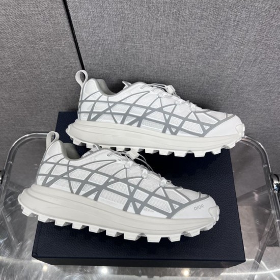 Dior B31 Runner Low Top Trainers In White Grey Profile Side profile pair of Dior B31 Runner Low Top Trainers in white grey resting on box