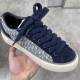 Close-up of Dior B33 trainer toe box in navy blue suede with thick woven laces