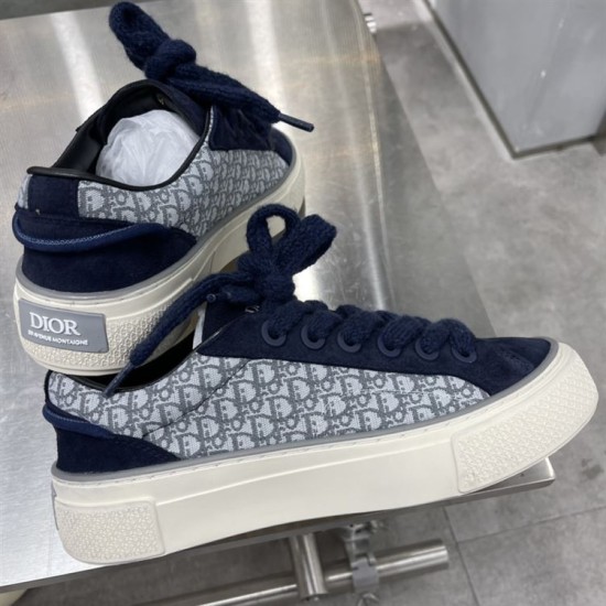 Rear angle of Dior B33 navy blue trainer showing heel plaque with brand lettering