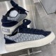 Rear angle of Dior B33 navy blue trainer showing heel plaque with brand lettering
