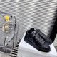 Dior B9S Black Quilted Leather Trainers Perspective View Side and top prospective shot of black Dior B9S quilted low top trainers on white display stand.