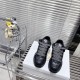 Dior B9S Black Quilted Leather Trainers Front View Front high-angle view of black Dior B9S quilted leather trainers with monogrammed laces.