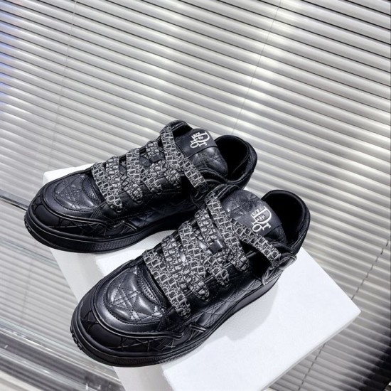 Dior B9S Black Quilted Leather Low Top Trainers Pair View Top angled view of pair of Dior B9S black quilted leather low top trainers on white block.