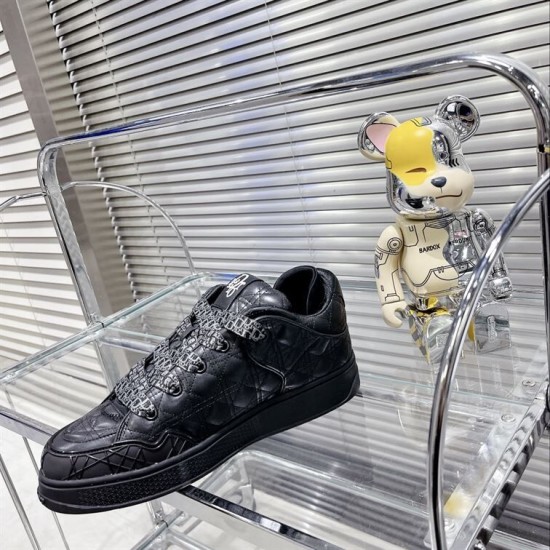 Dior B9S Black Quilted Leather Trainer Glass Shelf View Side view of black Dior B9S quilted leather trainer resting on clear glass shelving.