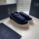 Dior Tears B33 Navy Blue Trainers Angled Front in navy blue and cream Angled front perspective of navy blue Dior Tears B33 trainers with thick navy laces in navy blue and cream