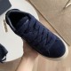 Dior Tears B33 Navy Blue Trainer Laces Close-Up in navy blue and cream Close-up hand view of Dior Tears B33 trainer front showing thick navy laces and suede toe box in navy blue and cream