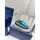 Dior B33 Blue Striped Trainers on Box Pair of Dior B33 blue striped trainers sitting on top of a navy blue shoe box