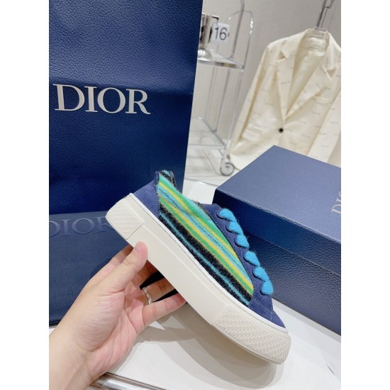 Dior B33 Blue Trainer Handheld Side View Hand holding a Dior B33 blue trainer displaying the thick off-white sole and side texture