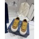 Dior B33 Trainers Front View in brown and yellow Top-down front view showing yellow laces on Dior B33 brown suede trainers
