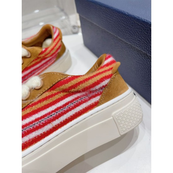 Dior B33 Striped Canvas Detail in brown and red Close-up of red and brown striped canvas panel on the Dior B33 Low Top Trainer