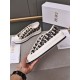 Hand holding a Dior navy blue oblique canvas platform trainer showing side sole detail