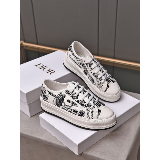 Pair of Dior Walk'n'dior platform low-top trainers in white and black shown from an elevated front angle