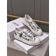 Pair of Dior Walk'n'dior platform low-top trainers in white and black shown from an elevated front angle