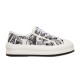 Side profile of Dior Walk'n'dior platform low-top trainers in white and black printed canvas