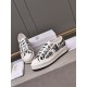 Front oblique view of Dior Walk'n'dior low-top trainers featuring white laces and printed uppers in white and black