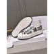 Dior Walk'n'dior platform trainer displayed alongside its star-patterned rubber sole in white and black