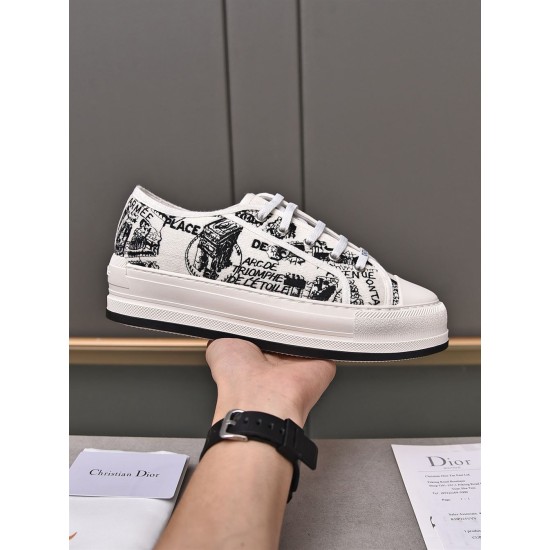 Hand holding the inner profile of a Dior Walk'n'dior printed canvas platform trainer in white and black