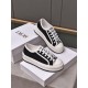 Dior Walk'n'dior Trainers Pair Angle View in black Pair of Dior Walk'n'dior low-top trainers in black and white display
