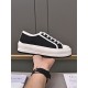 Dior Black Canvas Trainer Lateral View Side profile of Dior black canvas low-top trainer with white platform