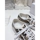 Close-up view of the interior lining and gold logo printed insole of Dior trainers in beige