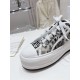 Dior Walk'n'dior Platform Trainer Toe Cap Detail in cream and navy Front view of rubber toe cap and laces on Dior Walk'n'dior Platform Trainer in cream and navy