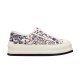 Dior Walk'n'dior Platform Low-Top Trainer Profile View in cream and navy Dior Walk'n'dior Platform Embroidered Low-Top Trainer in cream and navy profile view